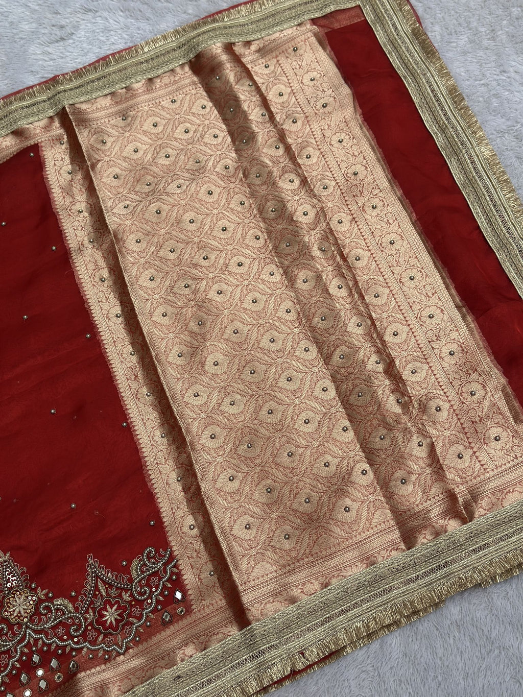 Hand-embroidered floral border with mirror work on red Banarasi tissue saree