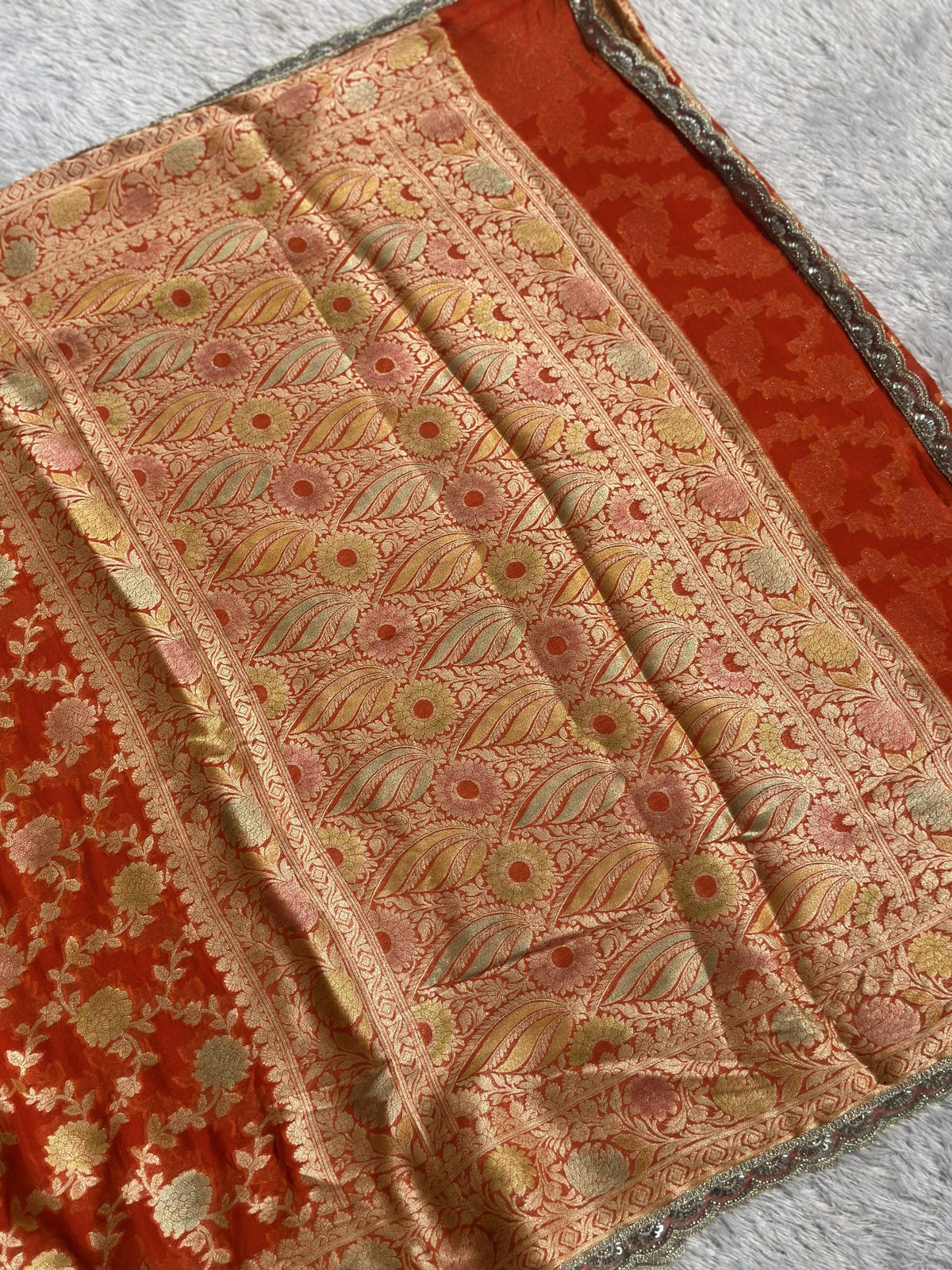 Orange Khaddi Georgette Banarasi saree with zari border and pallu