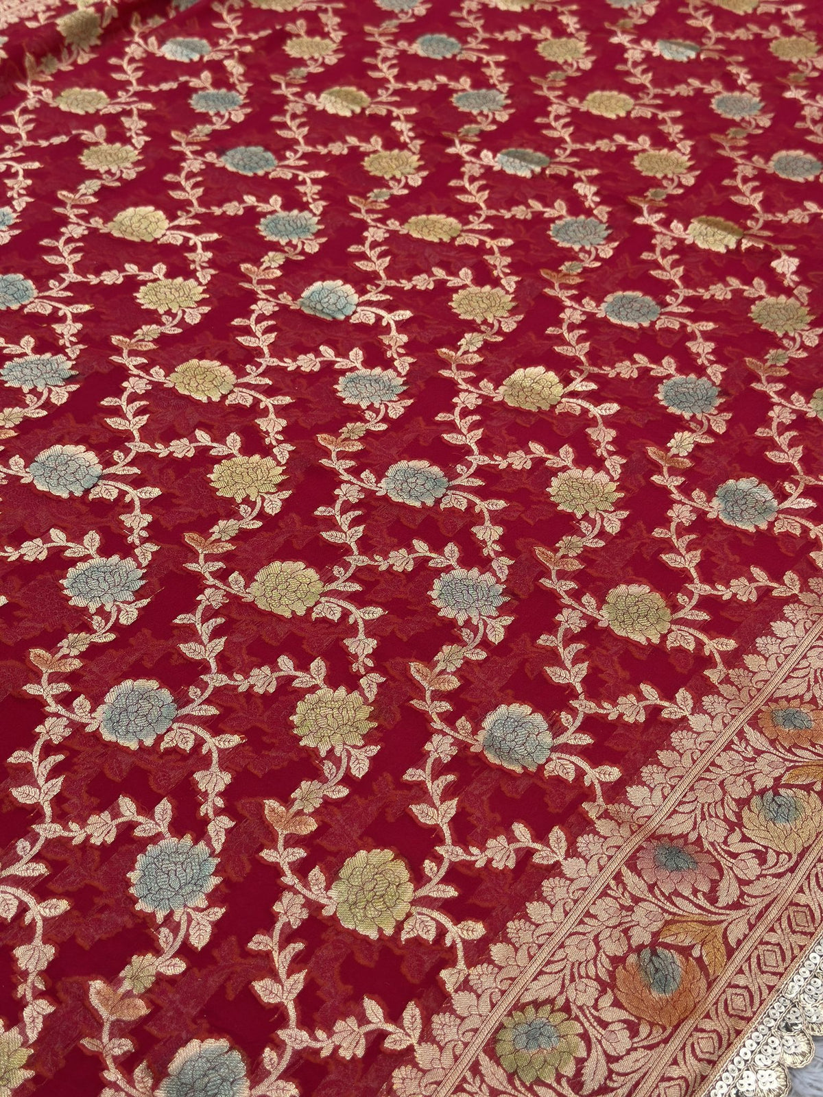 Zari weave close-up on pink Khaddi Georgette Banarasi saree