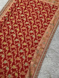 Bridal red Khaddi Georgette saree draped, featherlight fall