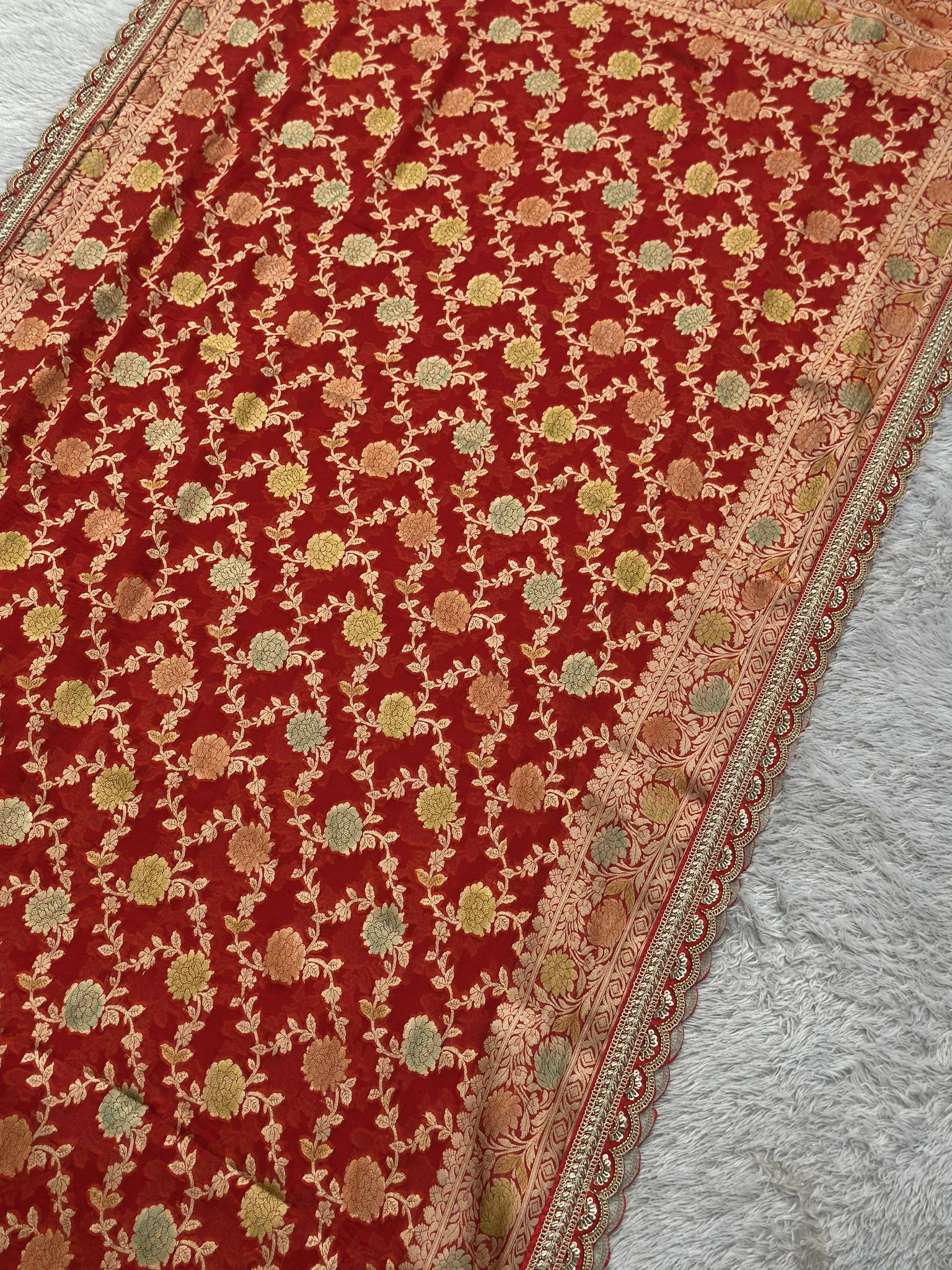 Bridal red Khaddi Georgette saree draped, featherlight fall
