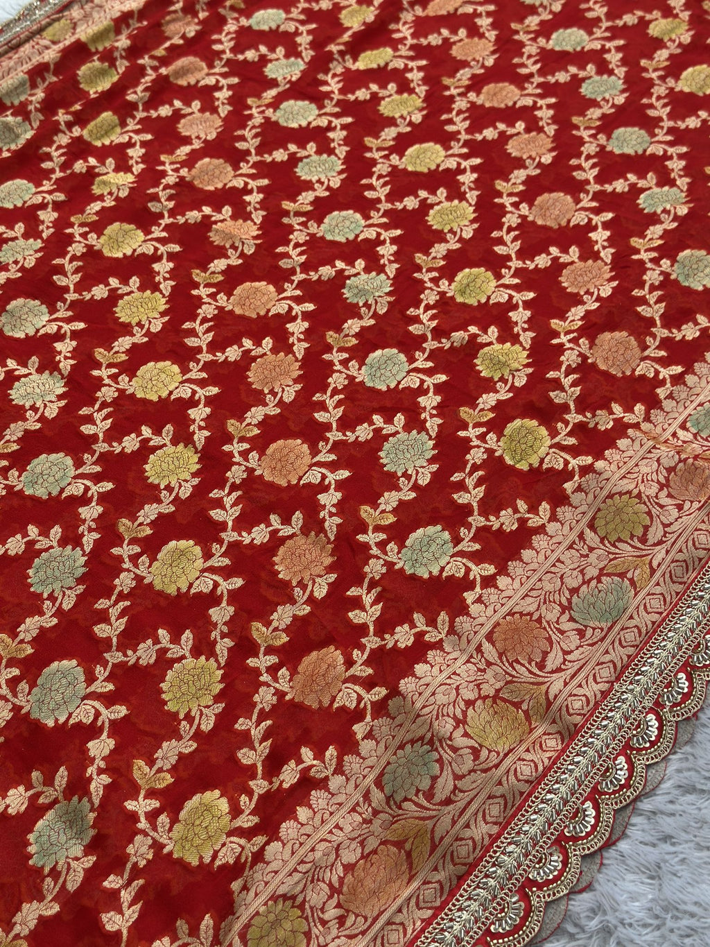 Zari border detail on red Khaddi Georgette Banarasi saree