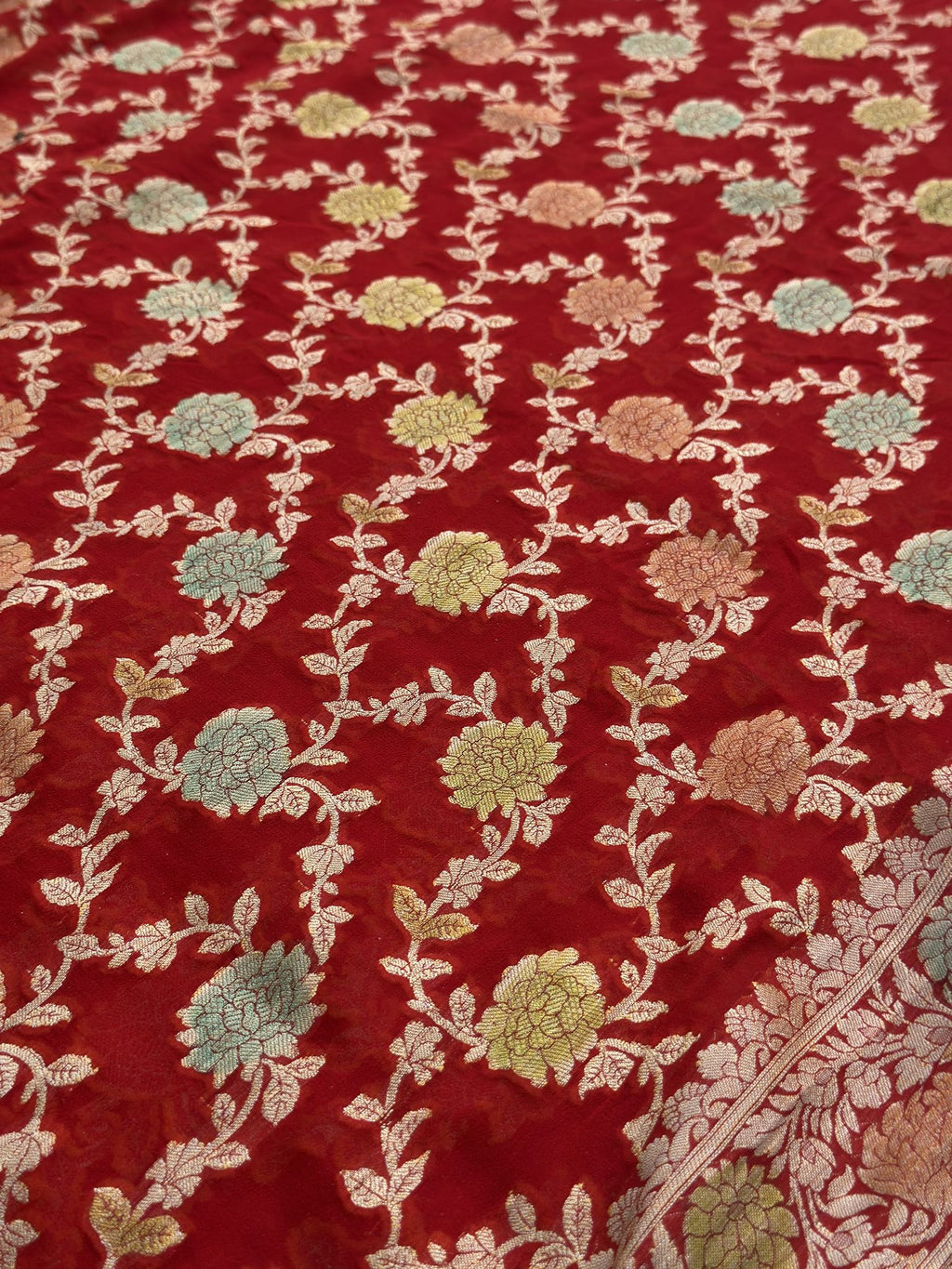Red Khaddi Georgette saree with included blouse fabric