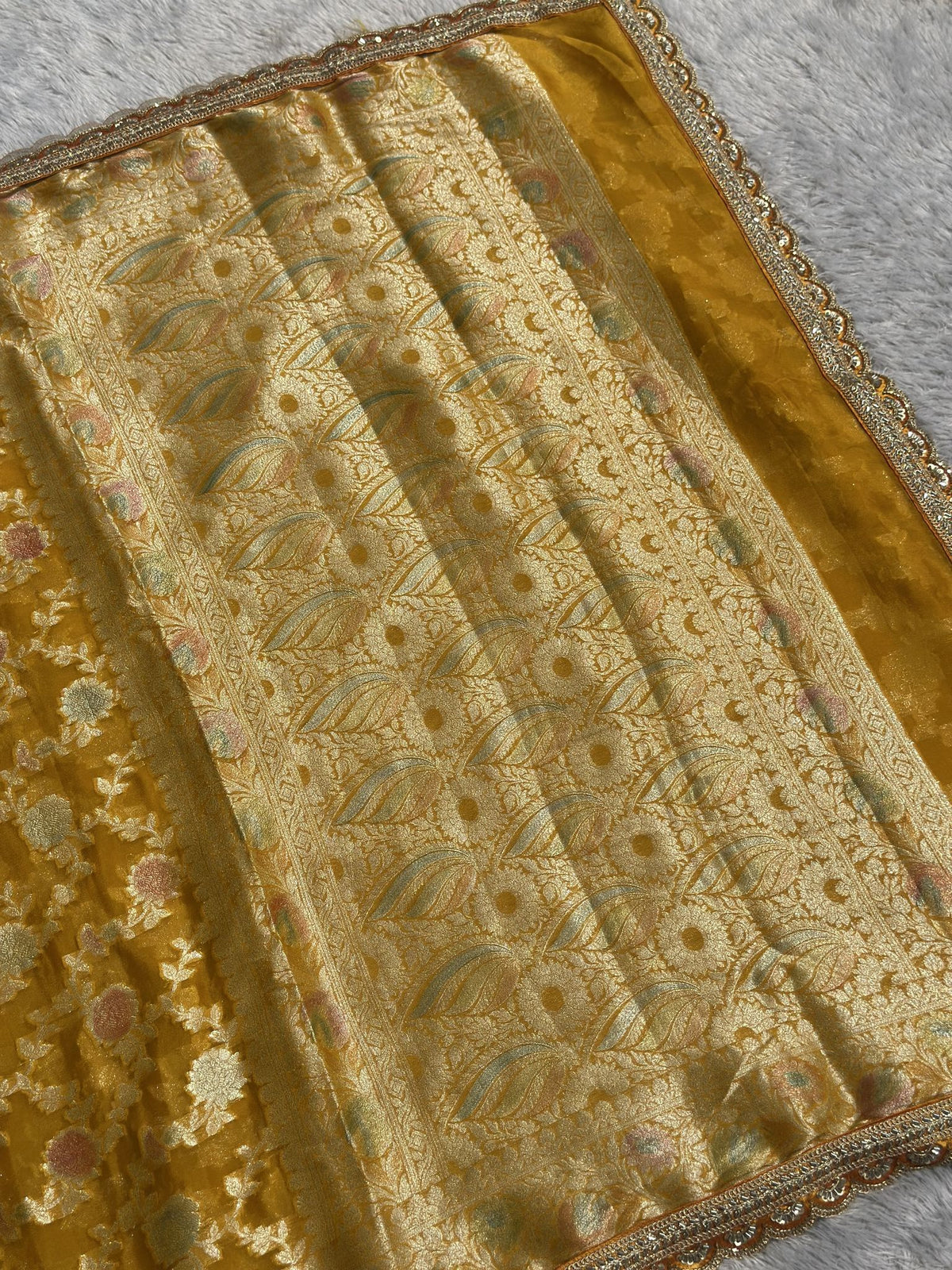 Yellow Khaddi Georgette Banarasi saree with zari border and pallu