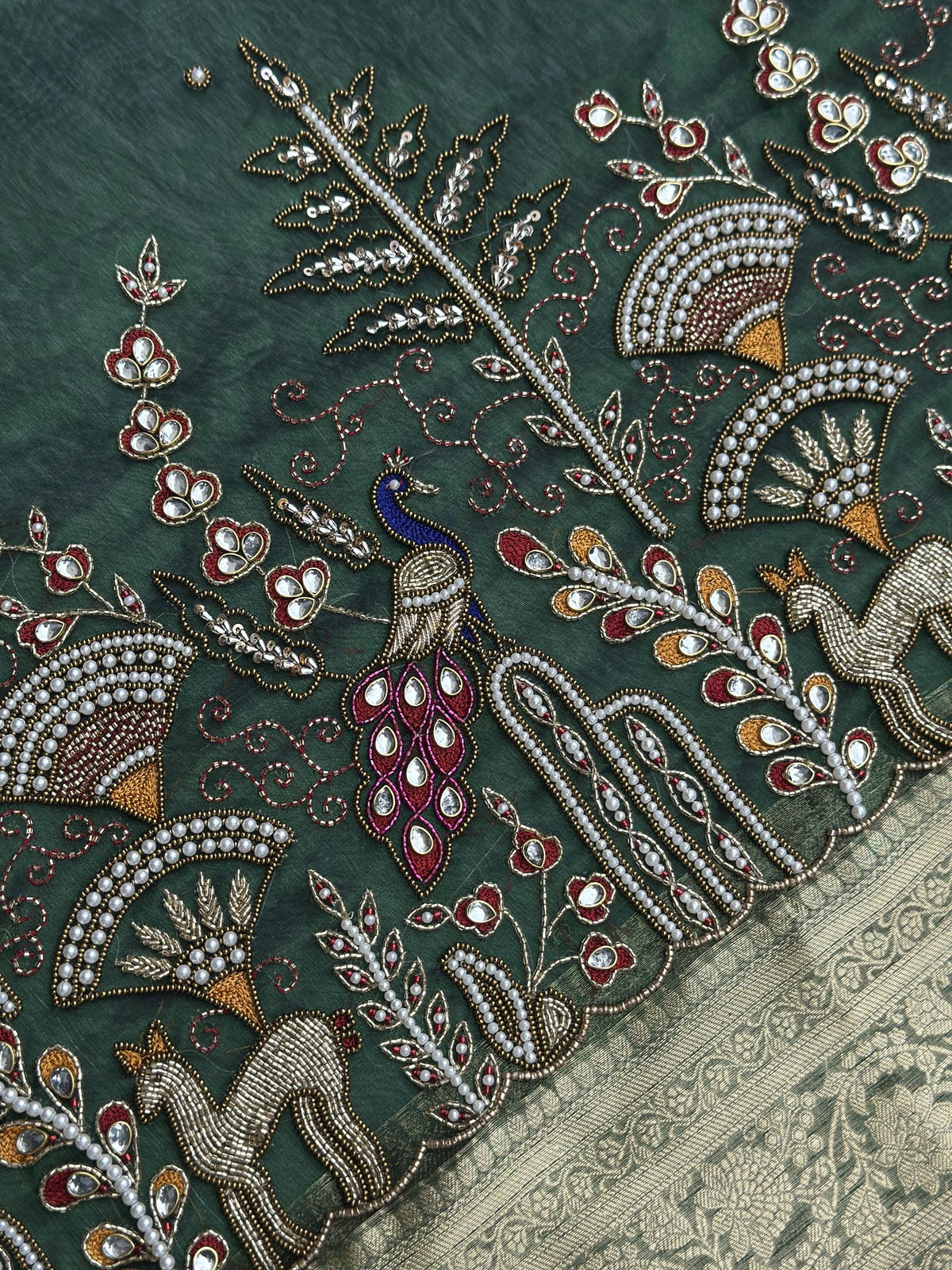 Gold zari weave detail on Mor Mahal Green saree