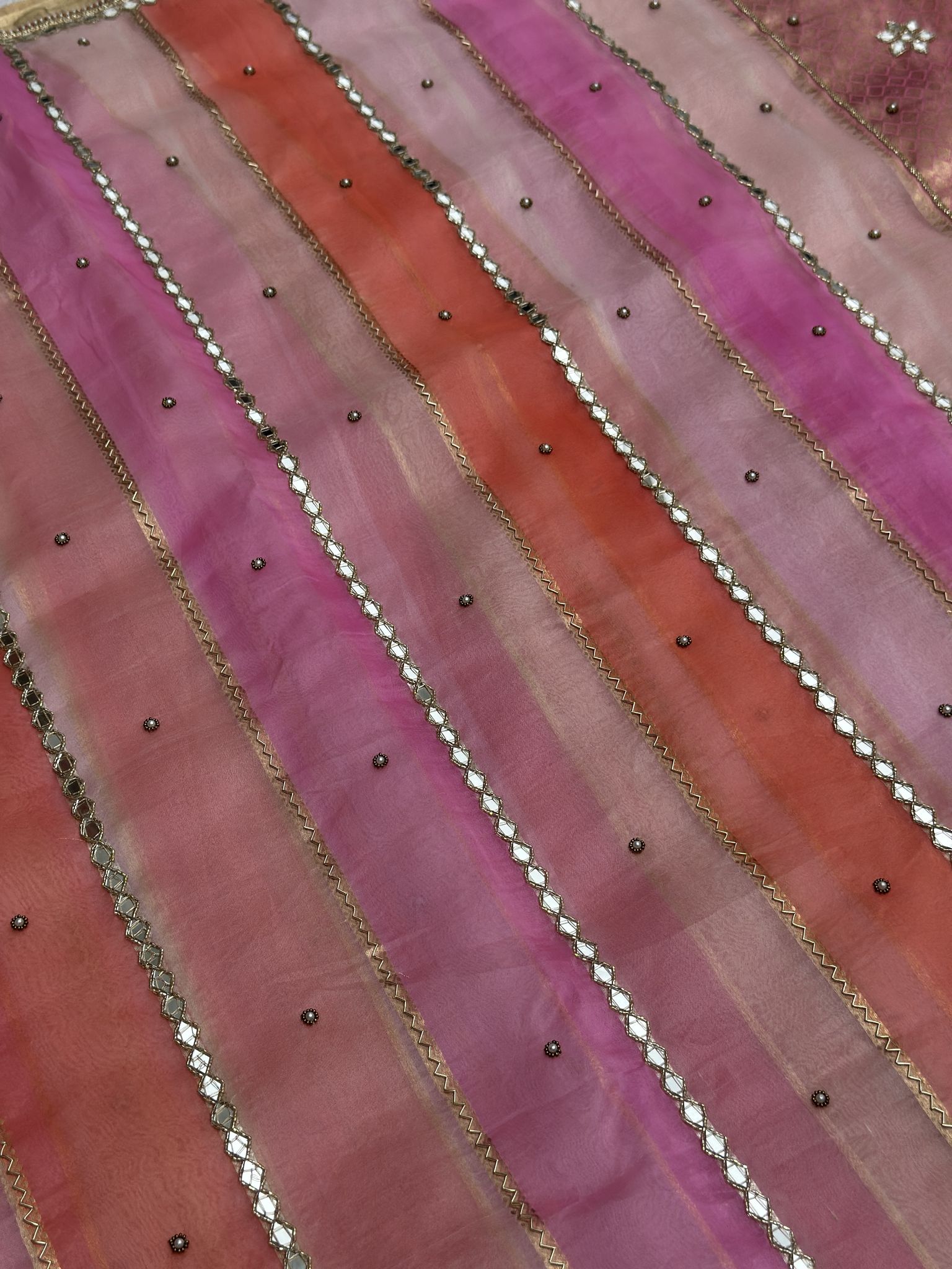 Rainbow pink and coral Kora silk saree with mirror stripes and pearl booti