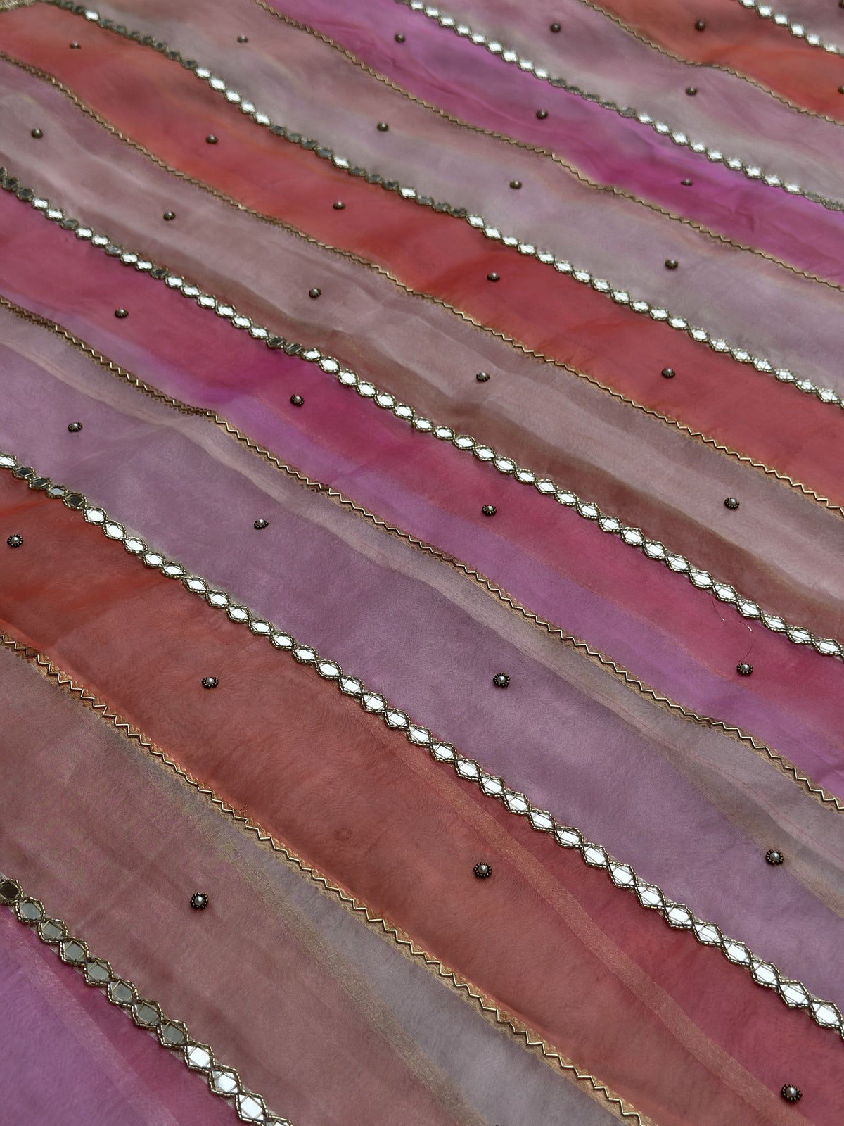 Close-up of sheesha mirror-work stripes on multicolor Kora silk saree