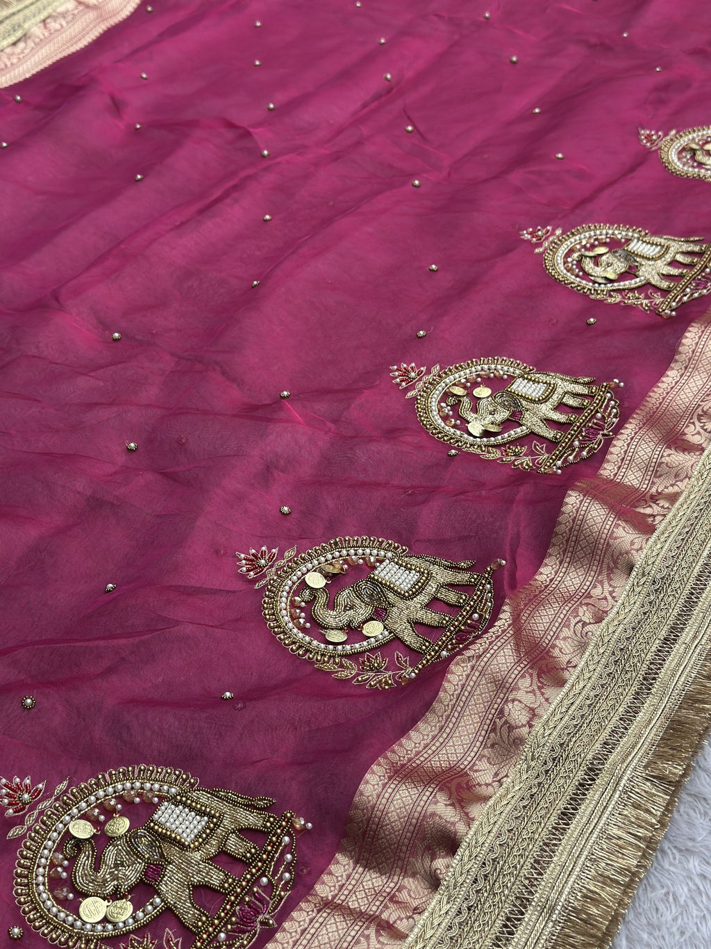 Gold zari elephant motif detail on Shahi Gajraj Pink saree