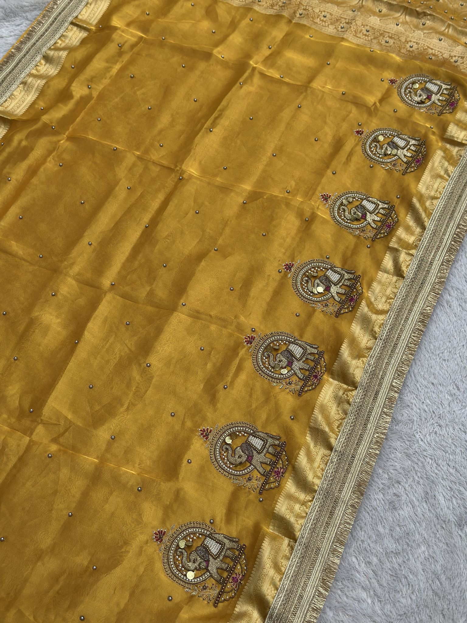 Yellow Banarasi tissue saree with royal gajraj elephant zari motifs