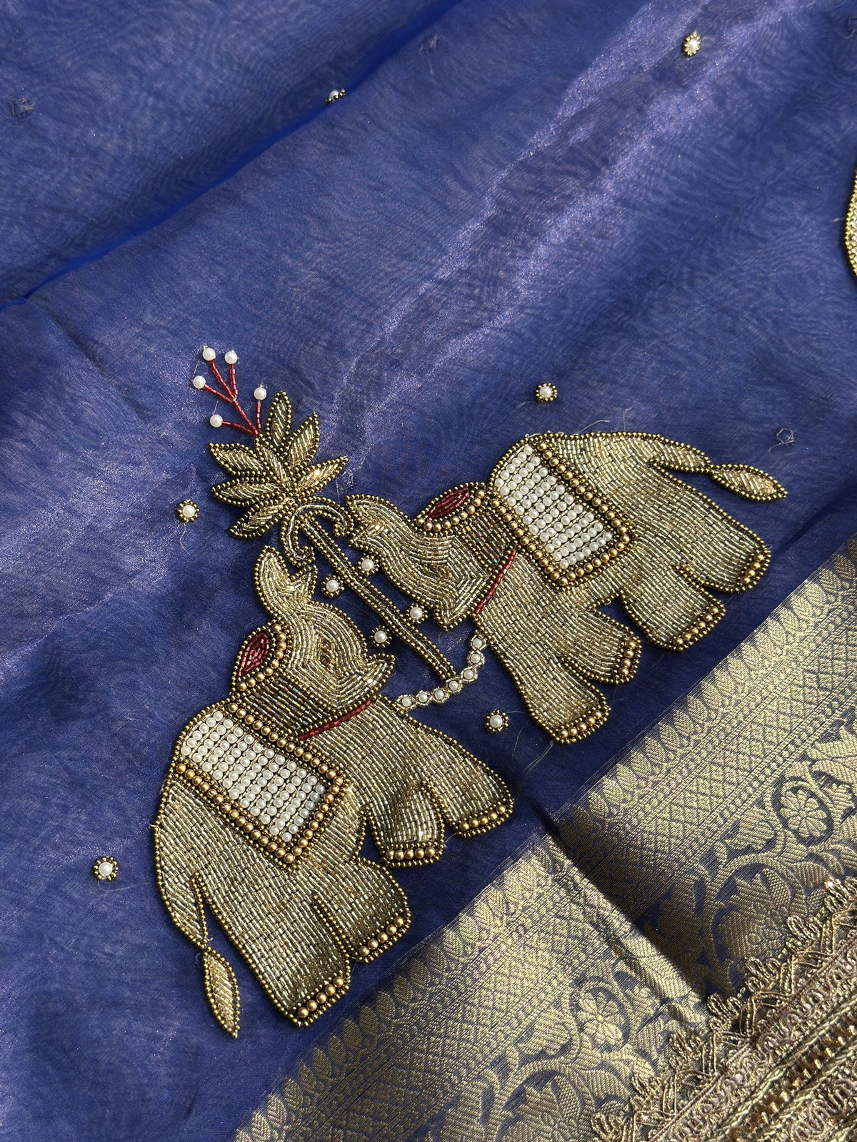 Hand-embroidered pearl and gold zardozi elephant motif on royal blue Banarasi tissue