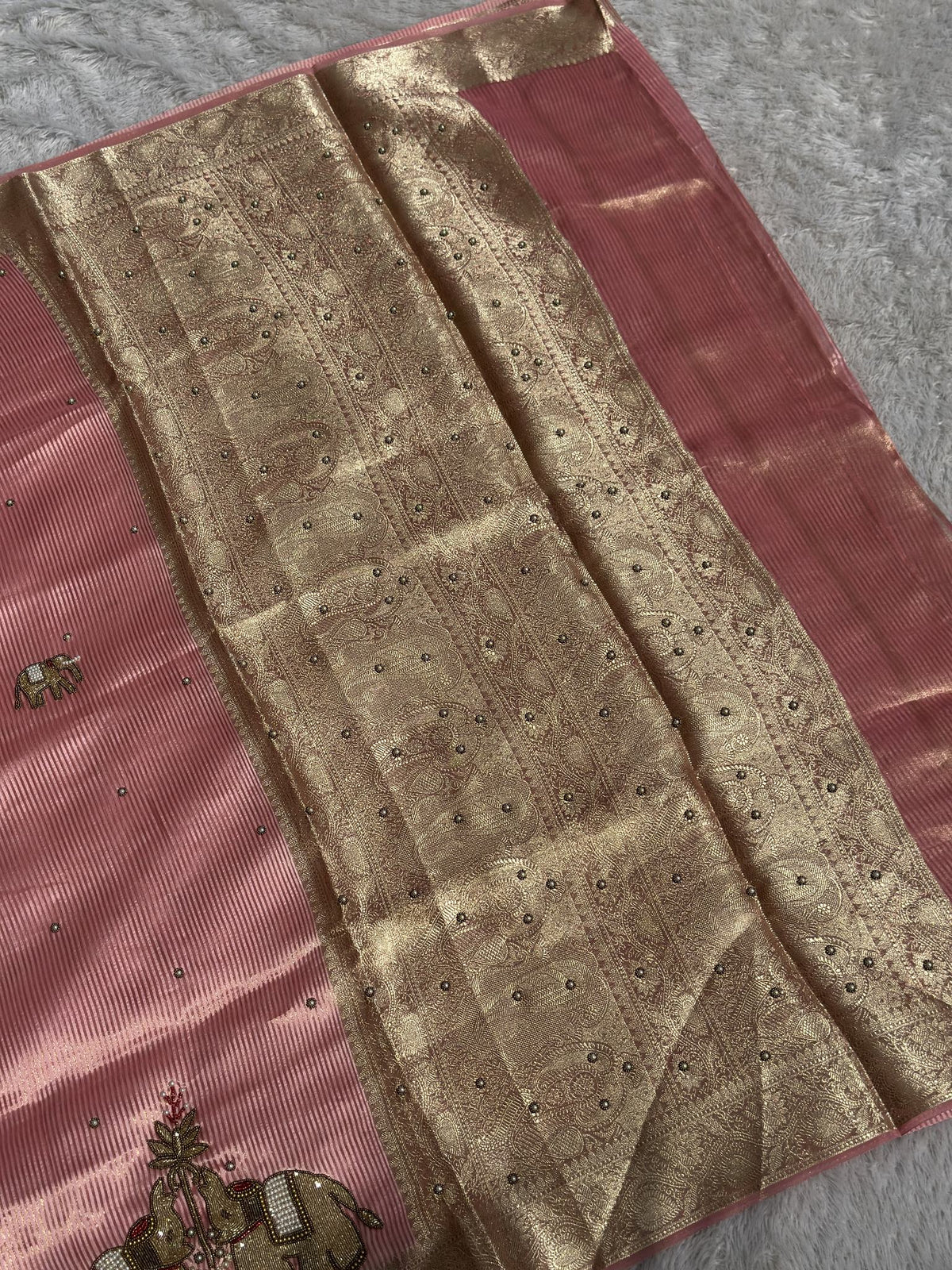 Suvarna Hatti Peach Chiniya tissue saree with gold zardozi elephant border